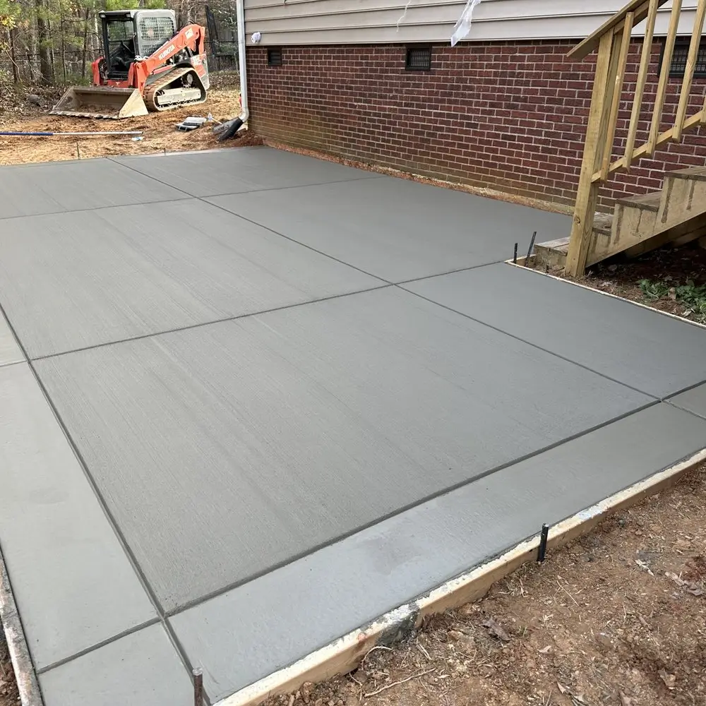 A freshly installed concrete patios by Northland Concrete Services, designed to complement the home’s exterior.