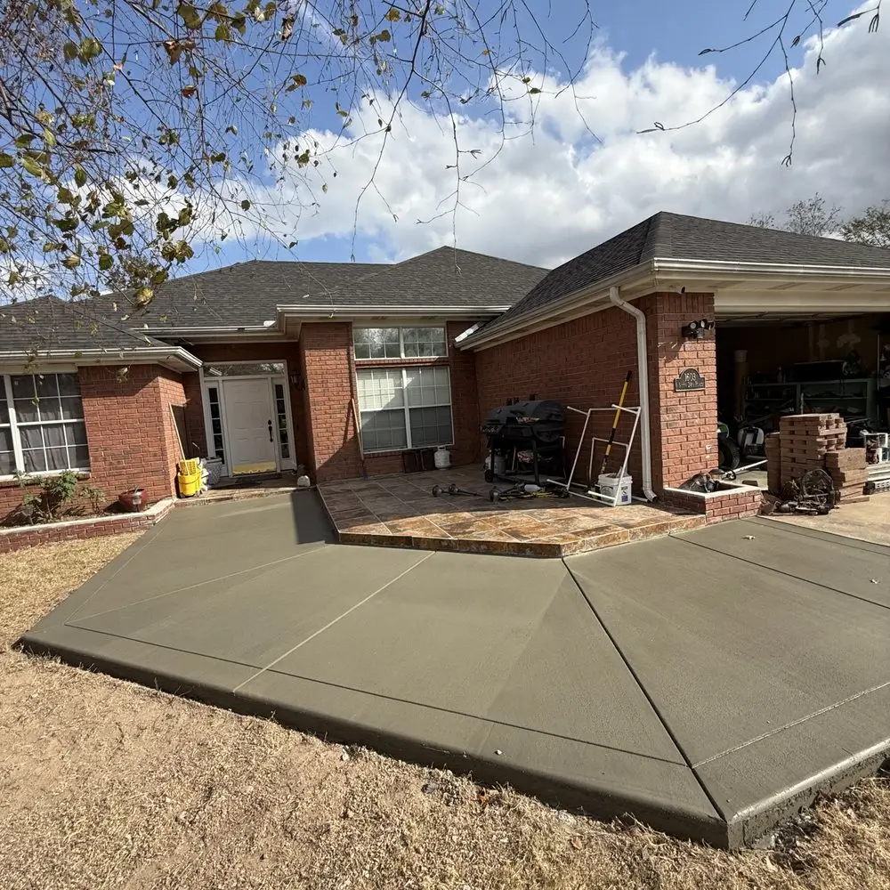A sleek and modern concrete patios by Northland Concrete Services, offering a smooth and durable surface.
