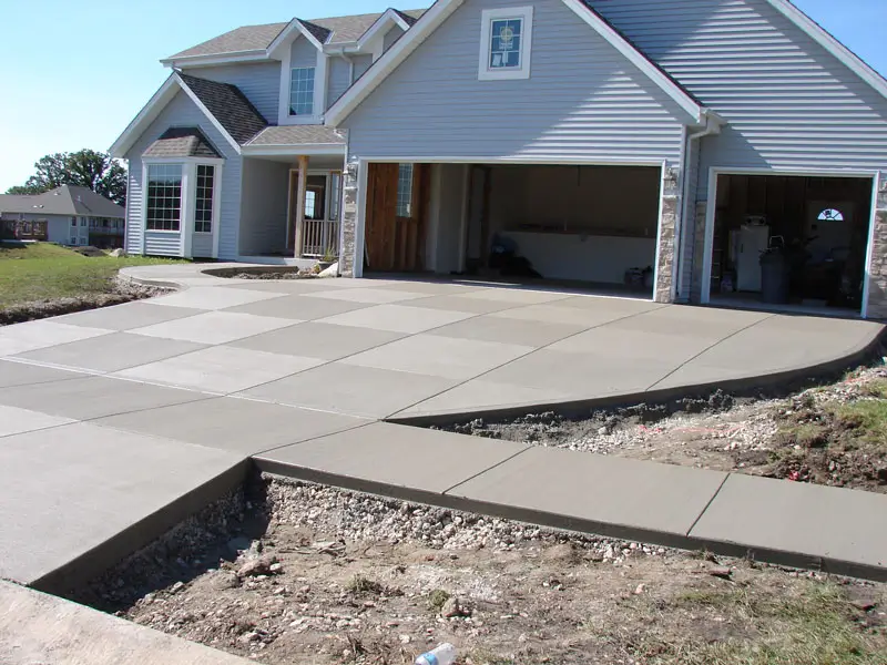A smooth and level concrete driveway by Northland Concrete Services, offering a clean and polished look.