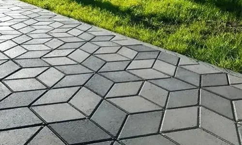 Northland Concrete Services workers using specialized mats to shape and imprint a high-quality stamped concrete patio. Northland Concrete Services workers using specialized mats to shape and imprint a high-quality stamped concrete patio.